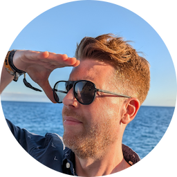 The guy who maintains Gremlinq on a boat looking at virtually nothing in the distance.